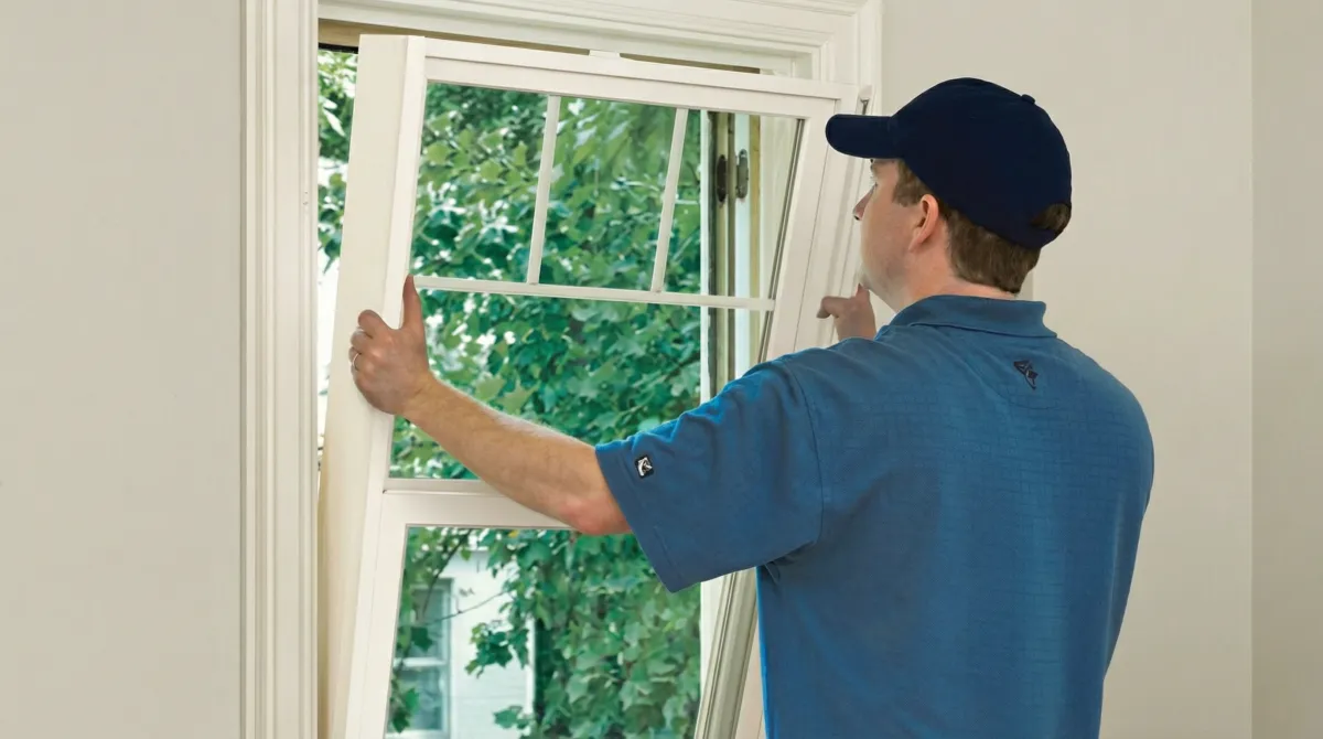 Professional contractors performing a residential window insulation and replacement service in Bellevue, WA